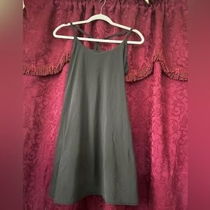 The brand is Outdoor Voices, it’s a small, all black exercise dress.